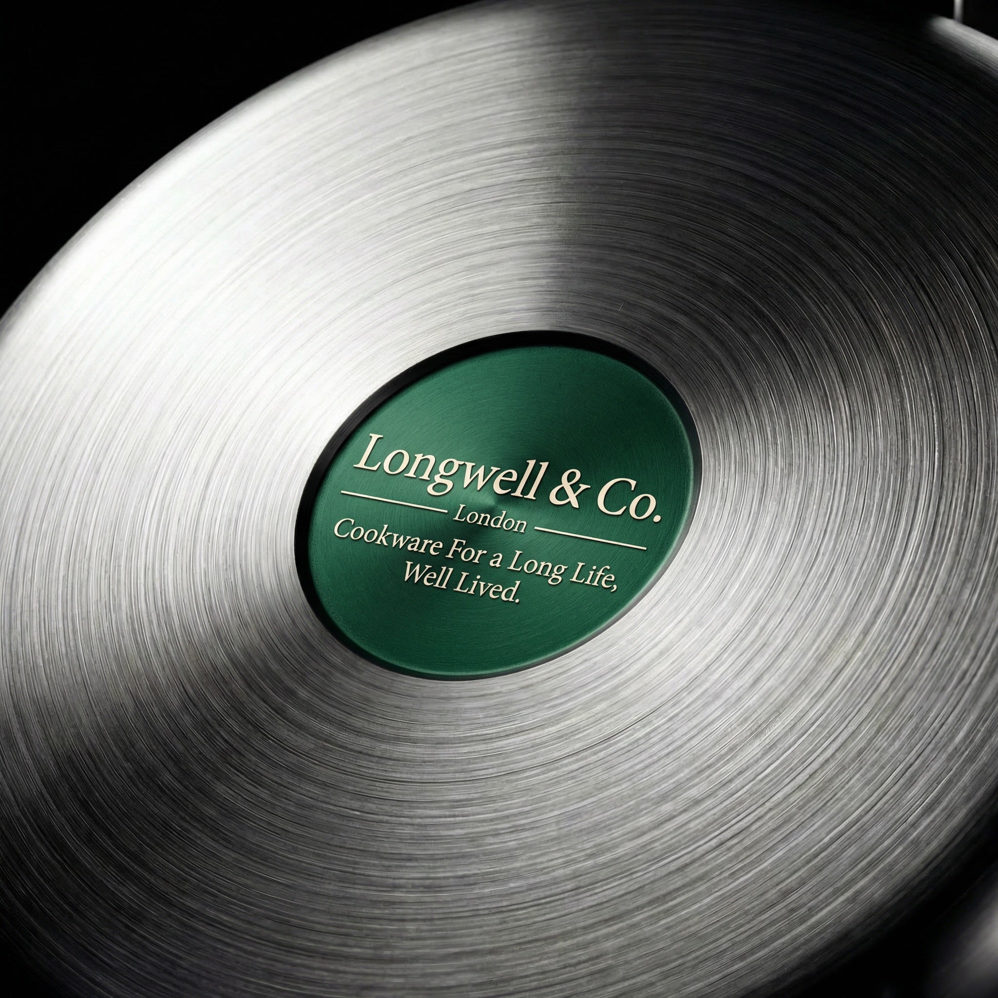 Longwell & Co logo on wok pan base – pure titanium cookware