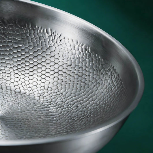 Close-up of titanium wok pan surface – hand-hammered texture – Longwell & Co